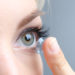 Medicine and vision concept - young woman with contact lens, close up (Bild: Africa Studio/fotolia.com)