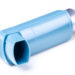 Turquoise asthma inhaler on white background with metal bottle