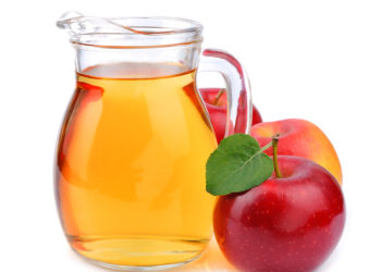 Apple juice drinks on white background close up