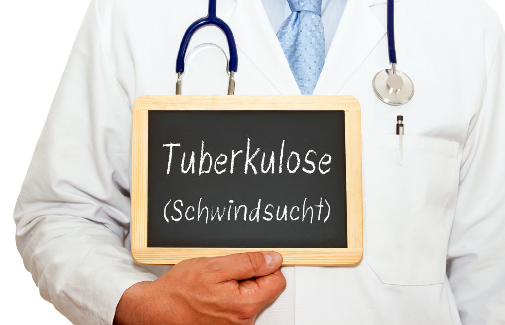 Arzt zeigt ein Schild, auf dem Tuberkulose (Schwindsucht) zu lesen ist