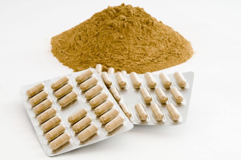 Heilerde in Pulverform und in Kapseln