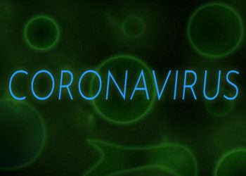 Der Schriftzug Coronavirus vor einem grünen Hintergrund