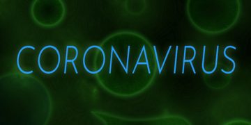 Der Schriftzug Coronavirus vor einem grünen Hintergrund