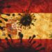 Auf einer Spanischen Flagge sind die Konturen von Viren abgebildet.
