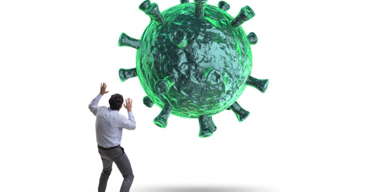 Eine grafische Darstellung zeigt, wie eine riesiges Virus auf einen Mann zugeflogen kommt, der schützend seine Arme hochhält.