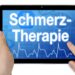 Auf einem Bildschirm wird das Wort "Schmerztherapie" angezeigt.