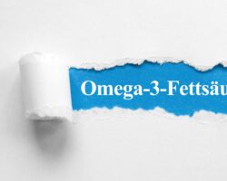 De Schriftzug Omega-3-Fettsäuren unter aufgerissenem Papier