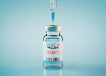 Ein Impfstoff-Fläschchen mit der Aufschrift "COVID-19 Vaccine Moderna".