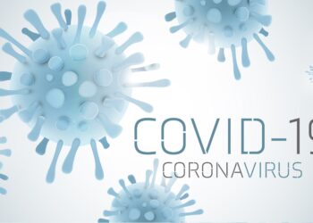 Bild von Virus mit Aufschrift COVID-19.