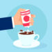 Eine comichafte Darstellung einer Hand, die Süßstoff in eine Tasse Kaffee gibt.