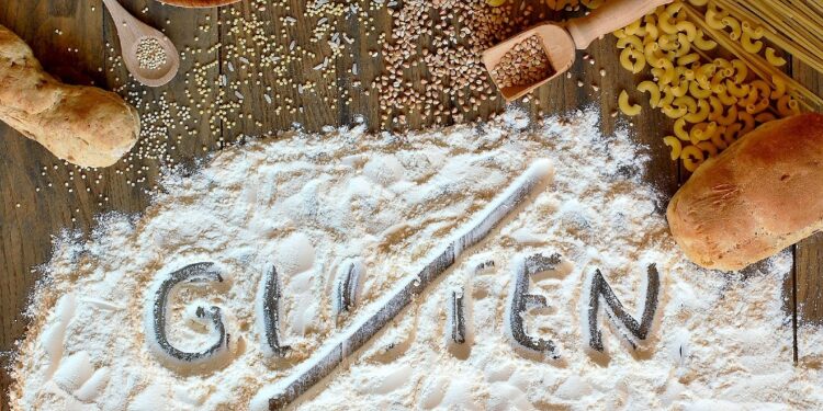 Das Wort "Gluten" in Mehl geschrieben und durchgestrichen.